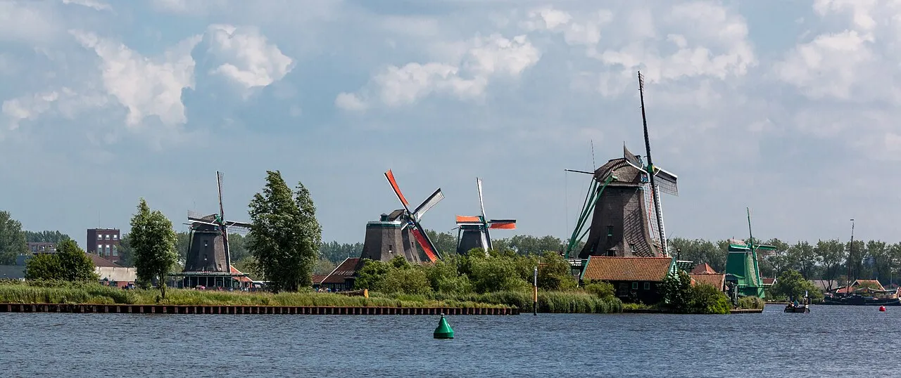 Historic windmills at Zaanse Schans beside the water